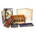 Medical related items comprising an Allergen Test set by Duncan Flockhart And Co in slant top walnut