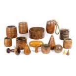A collection of treen comprising seven 19th Century or earlier crude grain measures including one