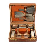 A pigskin silver fitted rectangular travel case by Asprey and Co Ltd, rectangular with twin locks,