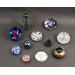 A collection of eleven 20th Century paperweights comprising a White Friars millefiori geometric