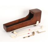 A 19th Century Church Warden’s pipe cot or cradle of stained wood, on rockers, 44 x 10.5 x 18cm,