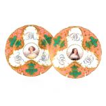 A pair of Sevres style plates each with central circular portrait, floral initials within pink and