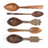 Five 19th Century wooden spoons comprising two similar examples with elaborate chip carved variant