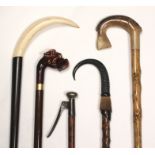 Five walking sticks comprising a Victorian gadget stick for picking fruit, 95cm, a Tyrolean