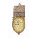 An eight-day wall hanging Swiss time piece, circa 1920, in oval gilt brass frame, gilded dial with
