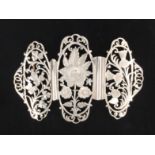A lady’s two-piece silver buckle comprised of three pierced and engraved oval panels, shamrock, rose