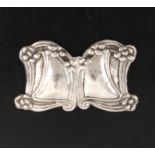 An Art Nouveau silver two-piece lady's buckle each of shaped form with a border of tendrils, London,