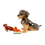 A Royal Copenhagen model of a Daschund puppy, 19cm high, and two others (3)