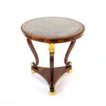 A Regency rosewood and parcel gilt centre table, the circular grey marble top within a crossband and