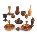 Eleven pieces of treen comprising a pair of Jerusalem Brighton bun candlesticks, 11.5cm dia, a