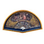 An early 19th century fan, the leaf depicting adults and children in a cottage tavern, 50cm,