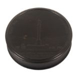 A 19th Century French Bois Durci circular snuff box, the lid titled ‘Fruit Des Victoires De L’