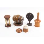 Five pieces of 19th Century treen comprising a faded rosewood barrel form string box with silver
