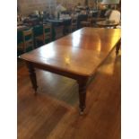 A Victorian mahogany draw leaf extending table, the moulded edge top over a frieze on four turned