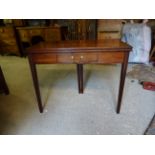 An early 19th Century mahogany Tea Table with fold over oblong top, single small frieze drawer and