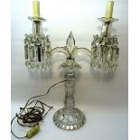 A Victorian glass two branch Table Lamp hung with spear and button cut lustre drops on a baluster