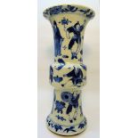 A Chinese Beaker Vase decorated in blue and white with figures etc and with four character mark to