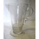 A Lalique glass Lemonade Jug with clear loop handle above a triangular pattern base and on a