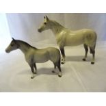 A Beswick Model of a small thoroughbred stallion No. 1992, in grey matt and another of a large