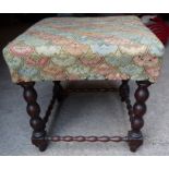 A 19th Century walnut Stool with upholstered top on knull turned supports and stretchers. 17" (