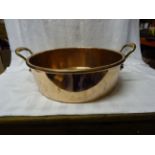 A Victorian copper two handled circular Dairy Bowl by Benham & Froud. 16" (41cms) diameter.