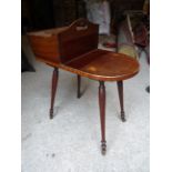 A 19th Century mahogany Cutlery Table with inlaid floral decoration, fitted with a hinged cutlery