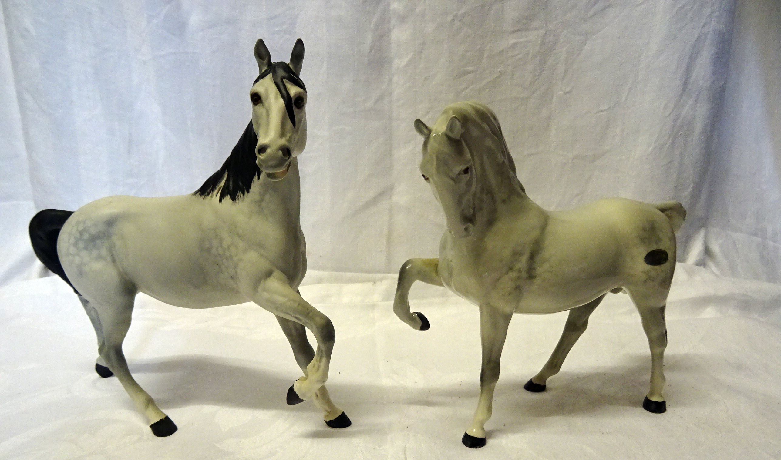 A Beswick Model of a grey horse with head tucked, No. 1549, first version and a Beswick matt grey