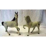A Beswick Model of a grey horse with head tucked, No. 1549, first version and a Beswick matt grey