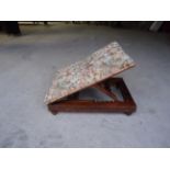 A Victorian Footstool with adjustable upholstered top on short turned supports.