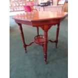 A late Victorian walnut octagonal Occasional Table with circular galleried undertier on turned