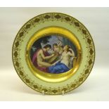 A "Vienna" porcelain Plate, the centre painted with an elliptical panel of classical figures