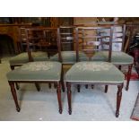 A set of five Regency mahogany frame Dining Chairs with reeded bar backs upholstered seats and