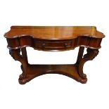 A Duchess design mahogany Dressing Table of serpentine outline with single frieze drawer, carved