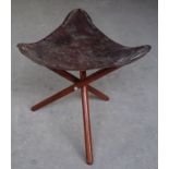 A leather seated tripod Stool.