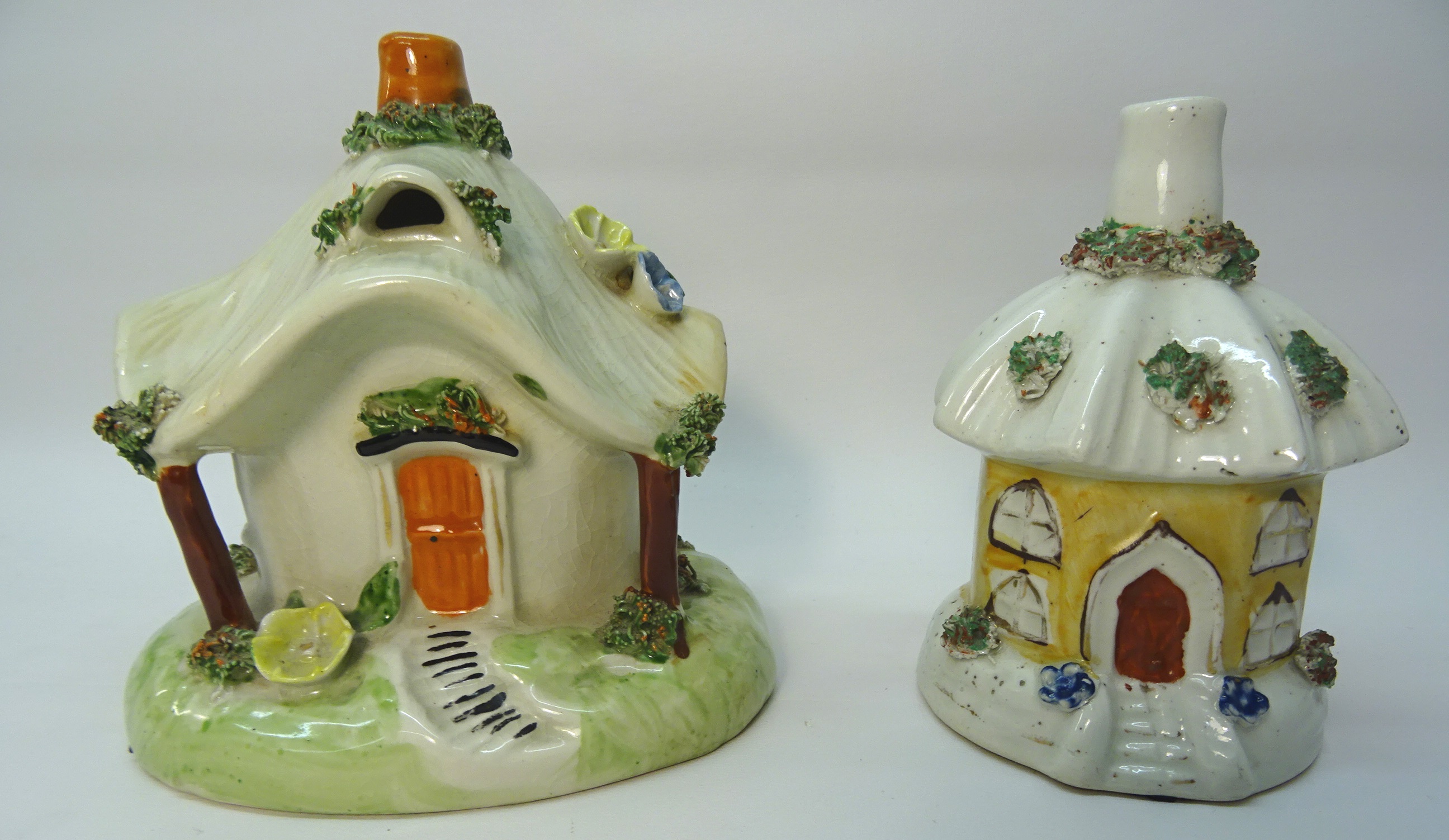 A Pastille Burner in the form of a cottage with thatched roof. 4 1/2" (12cms) high and a smaller