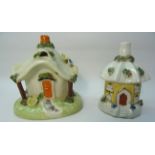 A Pastille Burner in the form of a cottage with thatched roof. 4 1/2" (12cms) high and a smaller