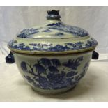 A Chinese export oval Tureen and Cover decorated with flowers and landscapes in blue and white and