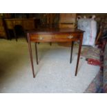 An early 19th Century mahogany bow fronted side Table inlaid with box wood stringing, fitted with