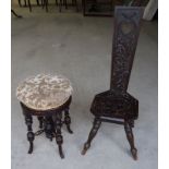 An early 20th Century carved oak Spinning Chair with panelled seat and splay supports and a