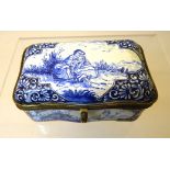 A 19th Century Faience ware Box of serpentine outline with hinged lid, decorated in blue and white