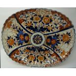 A late 19th Century Japanese Imari pattern oval shallow Dish with crimped rim decorated with