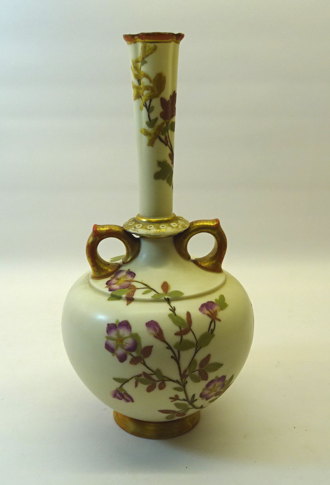 A Victorian Royal Worcester two handled baluster Vase painted with sprays of flowers with gilded