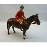 A Beswick Model of a huntsman on a brown horse, No. 1501.