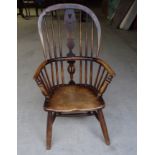 A 19th Century oak and elm Windsor high back Elbow Chair with pierced splat panel seat and splay