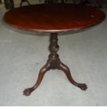 An early 19th Century mahogany circular Occasional Table on a vase turned column and carved triple