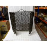 A wrought iron and mesh three division folding Spark Guard.