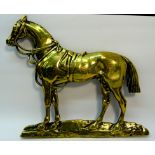 A Victorian brass hearth Ornament in the form of a horse. 8" (20cms) high.