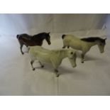 A Beswick Model of a grey mare, No.1991, first version another in brown gloss and another in matt