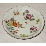 An 18th Century Chelsea circular shallow Bowl decorated with sprays of flowers in pink yellow blue