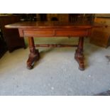 An early Victorian mahogany Centre Table fitted with two frieze drawers, raised on leaf carved